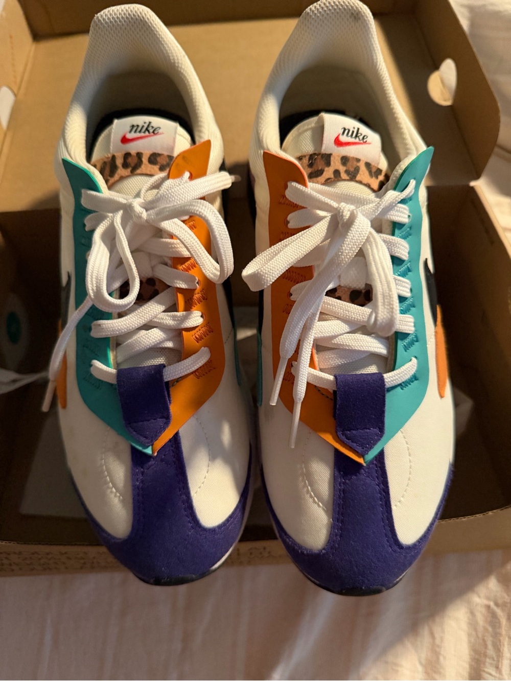 Nike White Sneakers with Teal, Orange & Purple Accents